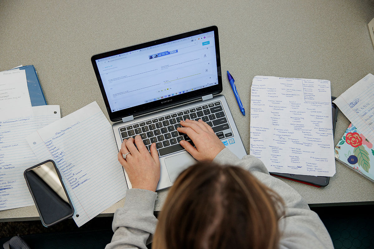 Student using a laptop to access Canvas.