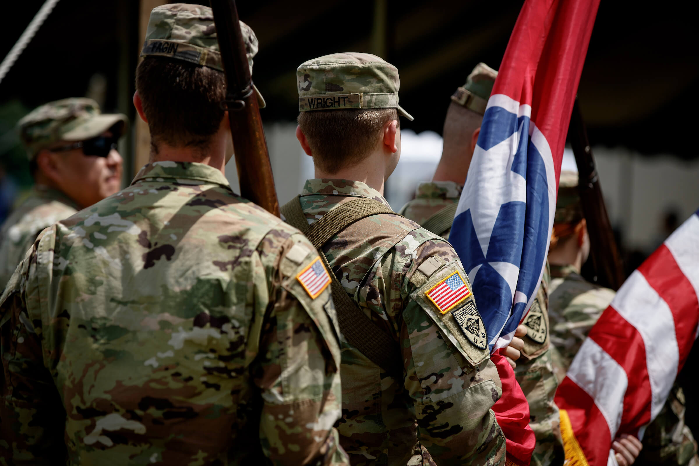 Members of the Skyhawk Battalion facing away from the camera.